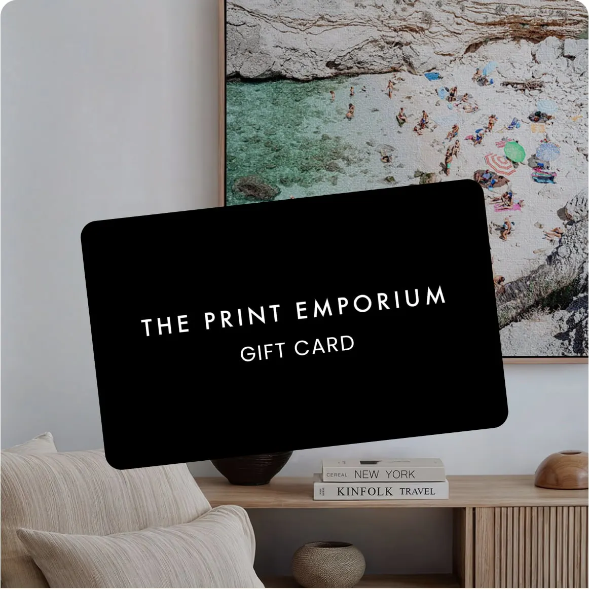 The Print Emporium gift card in front of framed wall art